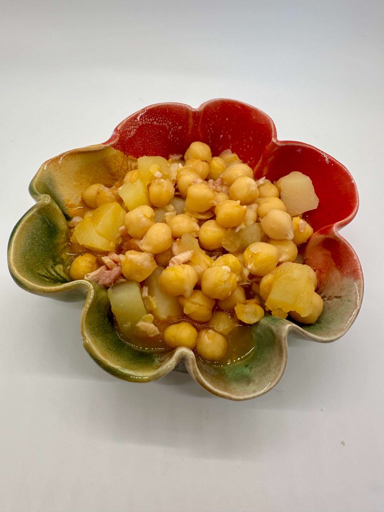 Hurst garbanzo beans and potatoes in a multicolored dish